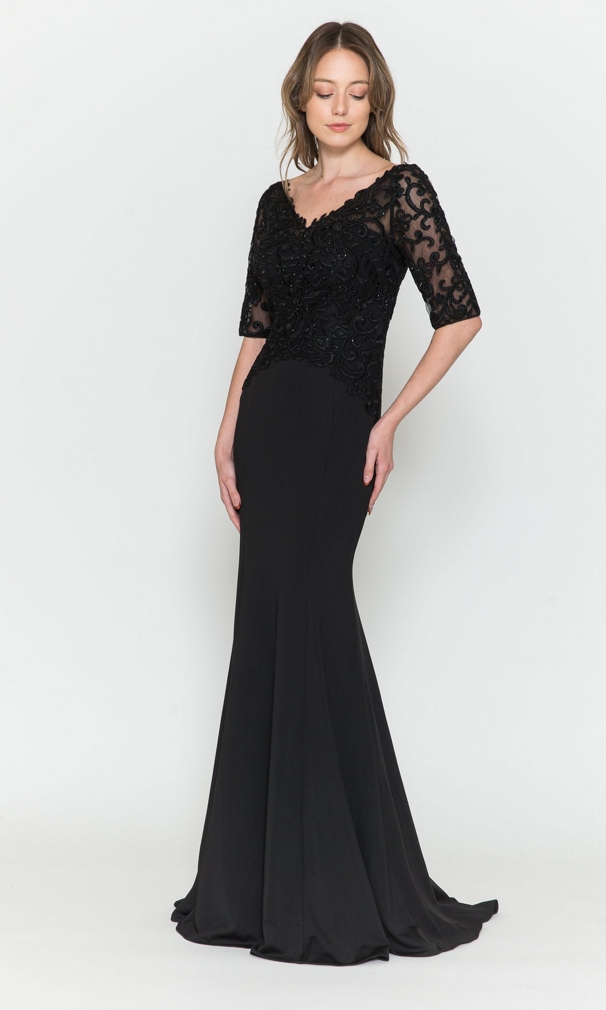 A woman models the Embroidered Sheer-Sleeved Formal Prom Dress 8560 in black, featuring a floor-length silhouette, fitted bodice, lace half sleeves, and flared skirt against a plain white background.
